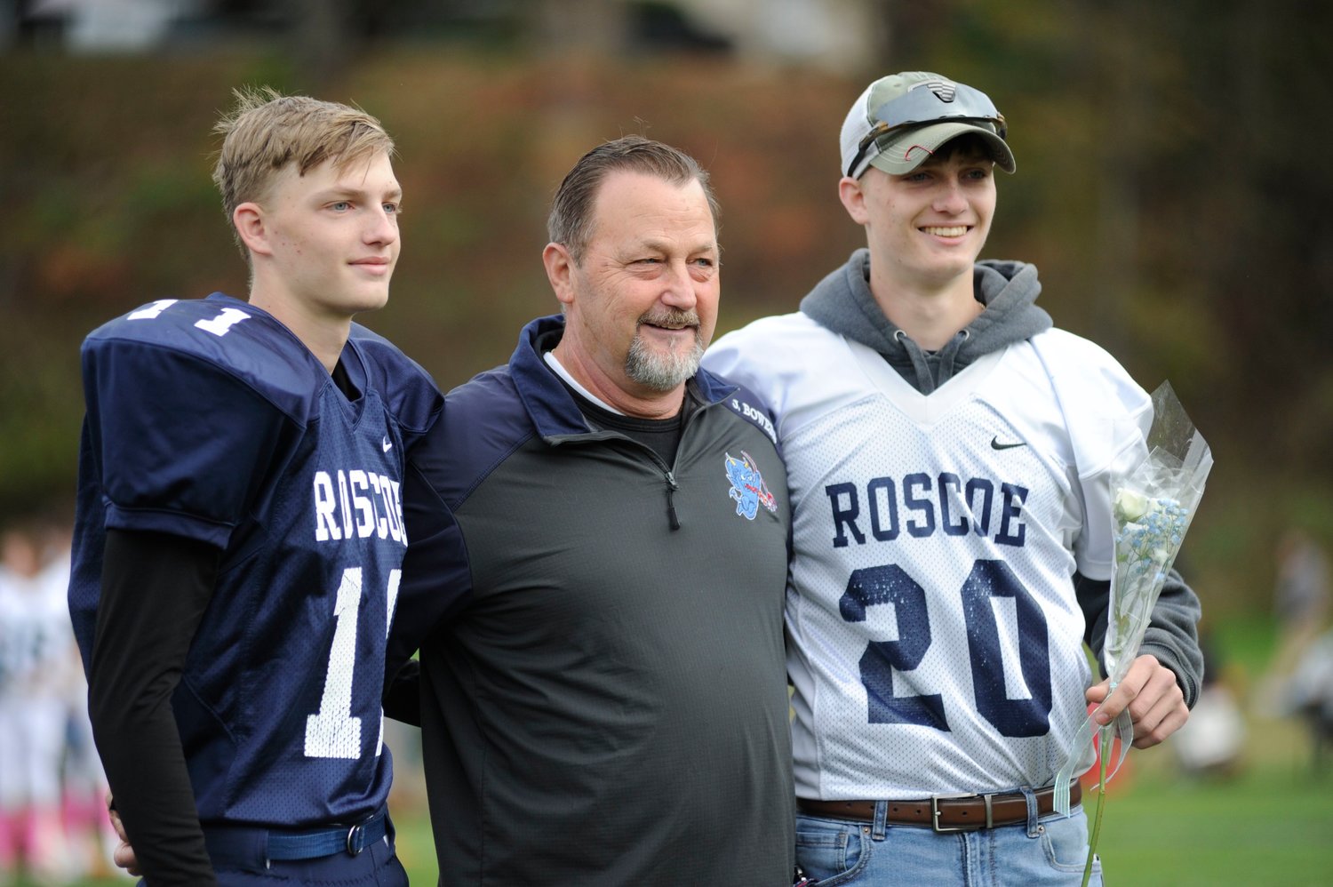Blue Devils honor senior football players. Pictured are seniors Matthew Bowers and Nathan Bowers with their proud father.